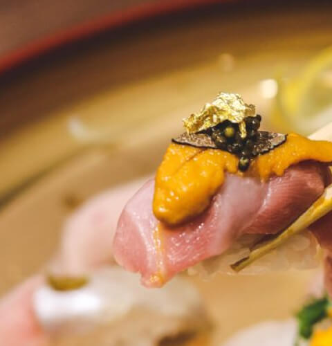 A bowl combining sushi and noodles